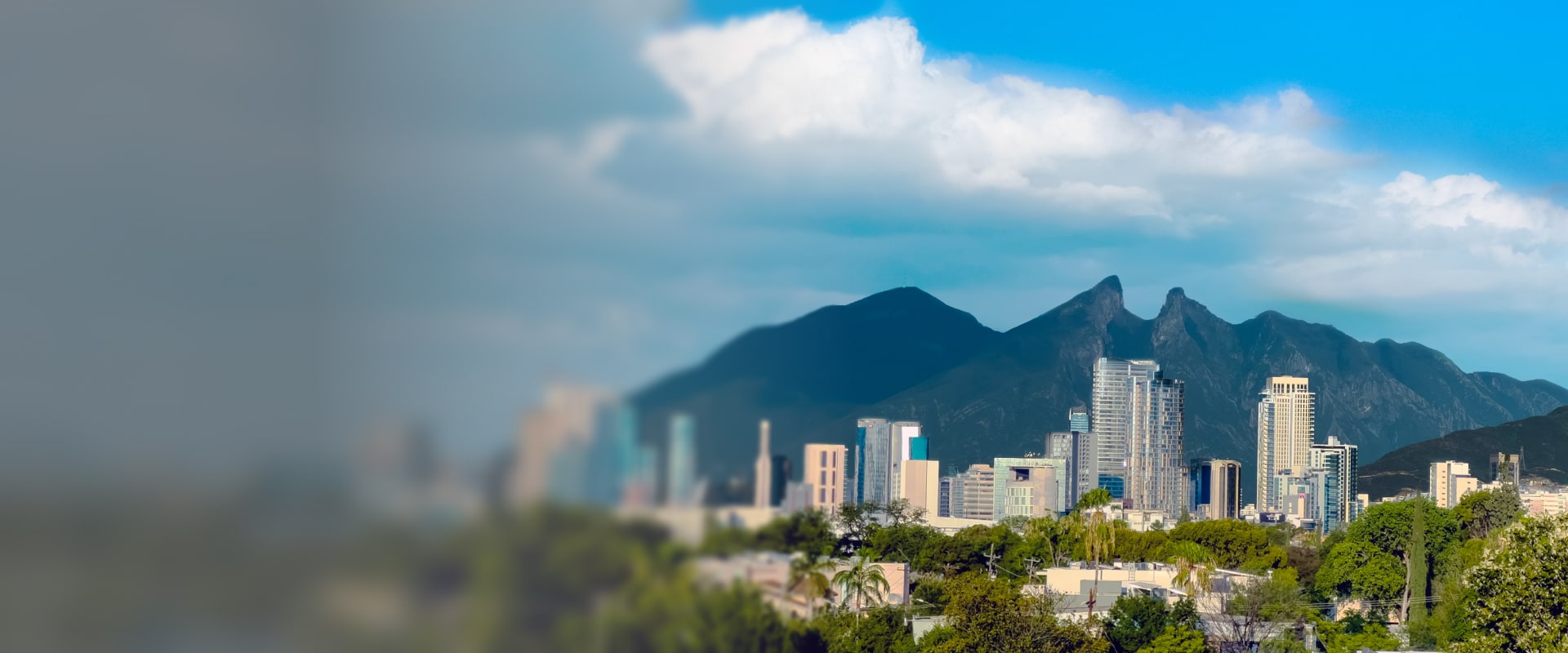 Illustration of a person holding a magnifying glass in front of a globe with red location markers highlighting various places around the world.